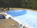 installation et pose du liner d'étanchéité, mise en eau